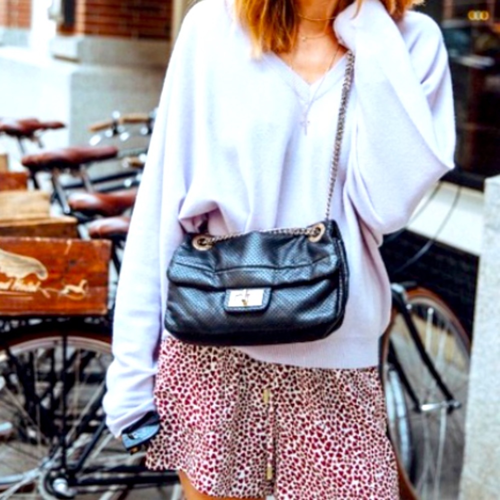 Chanel Gold Drill Perforated Leather Medium Flap Bag.